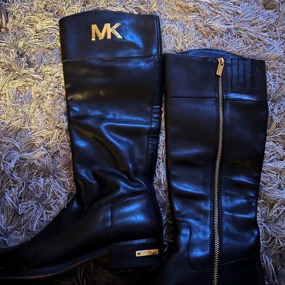 Michael Kors leather boots with gold zipper and logo.